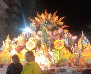 Mata Ki Chowki darbar with sun-shaped backdrop and stage lighting